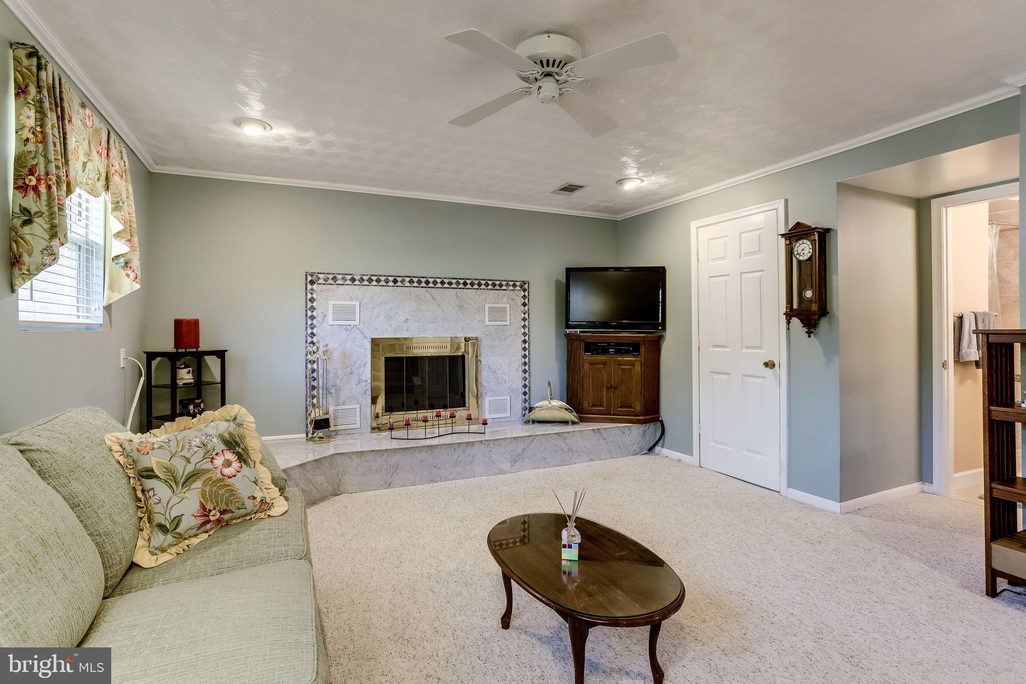 128 North Garfield Road Sterling, VA 20164 - Photo 25 of 39 Warm up by the wood-burning fireplace