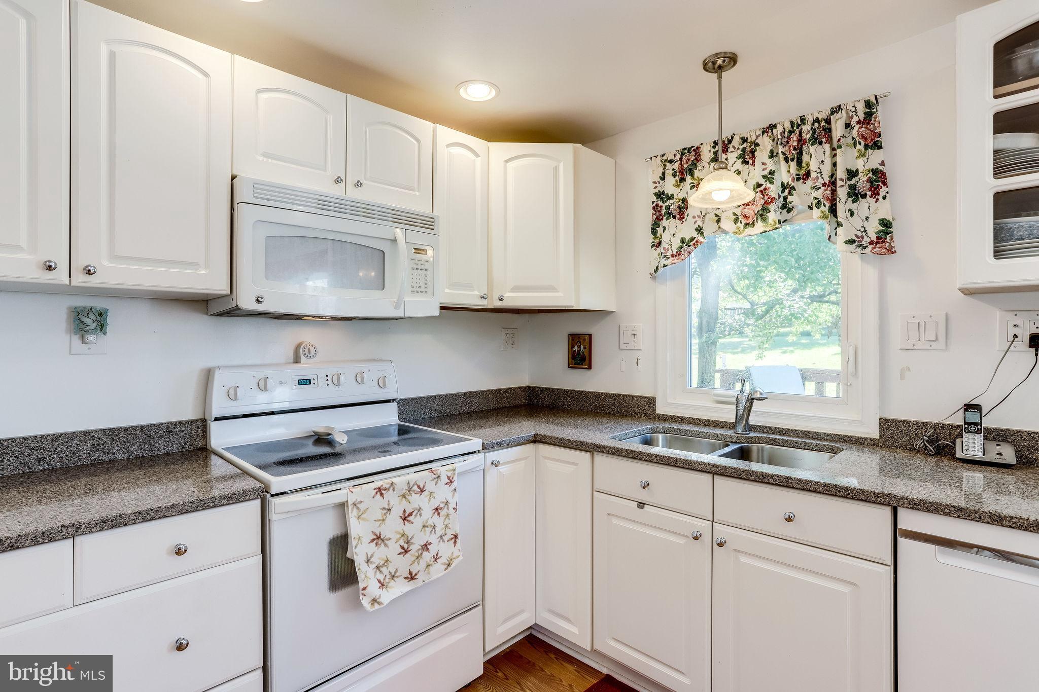 128 North Garfield Road Sterling, VA 20164 - Photo 7 of 39 Window above the sink looks to the yard