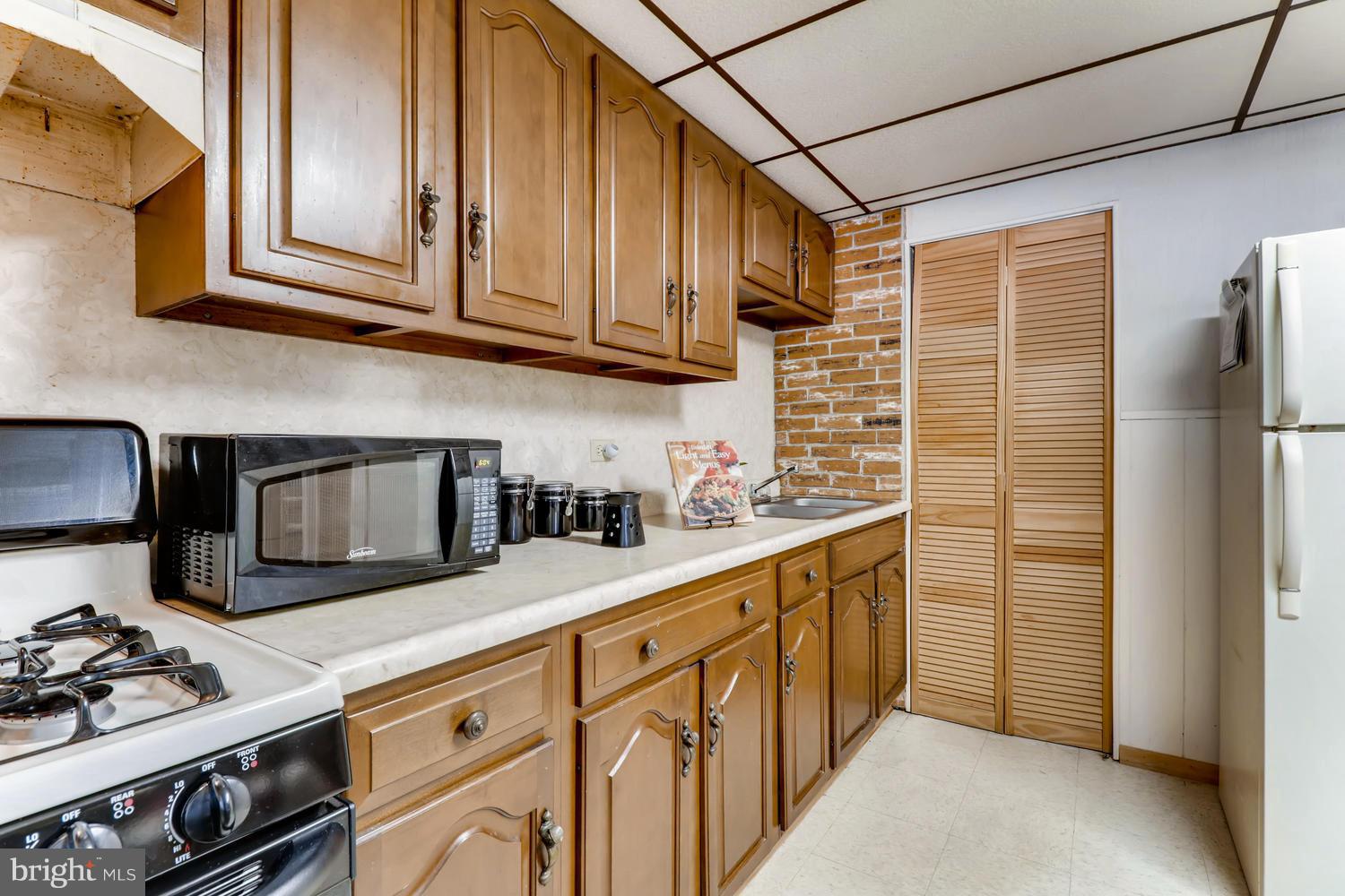 2717 Hollins Ferry Road Baltimore, MD 21230 - Photo 13 of 30 Gas range stove and plenty of storage space