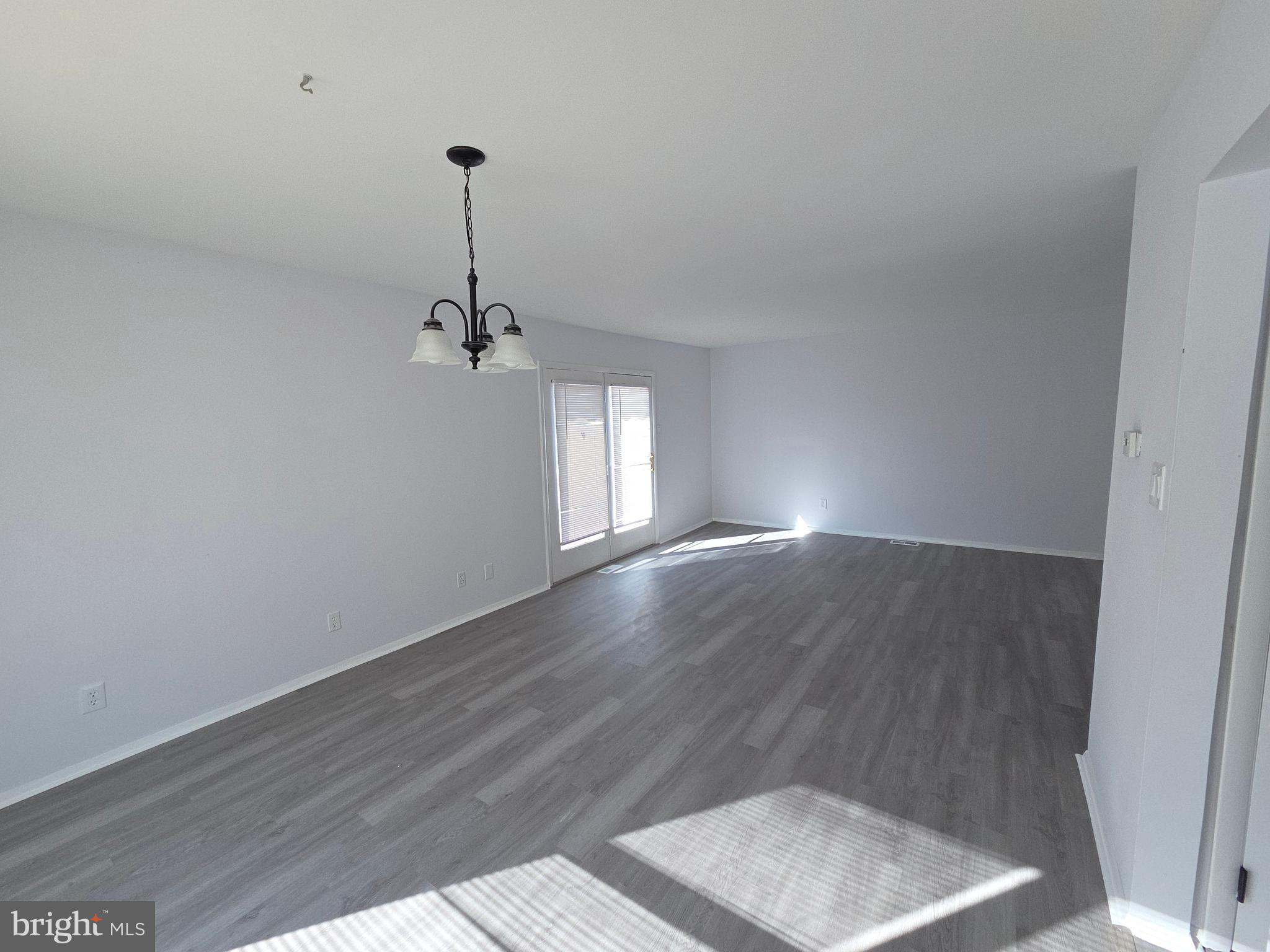 70 Suburban Boulevard Delran, NJ 08075 - Photo 11 of 40 a view of empty room with wooden floor and fan