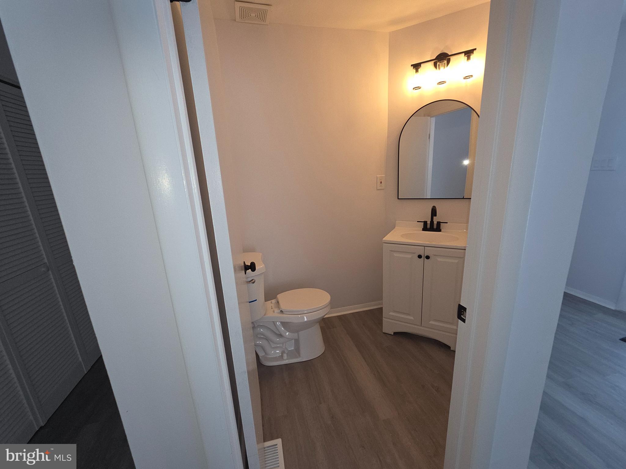 70 Suburban Boulevard Delran, NJ 08075 - Photo 22 of 40 a bathroom with a toilet sink and mirror