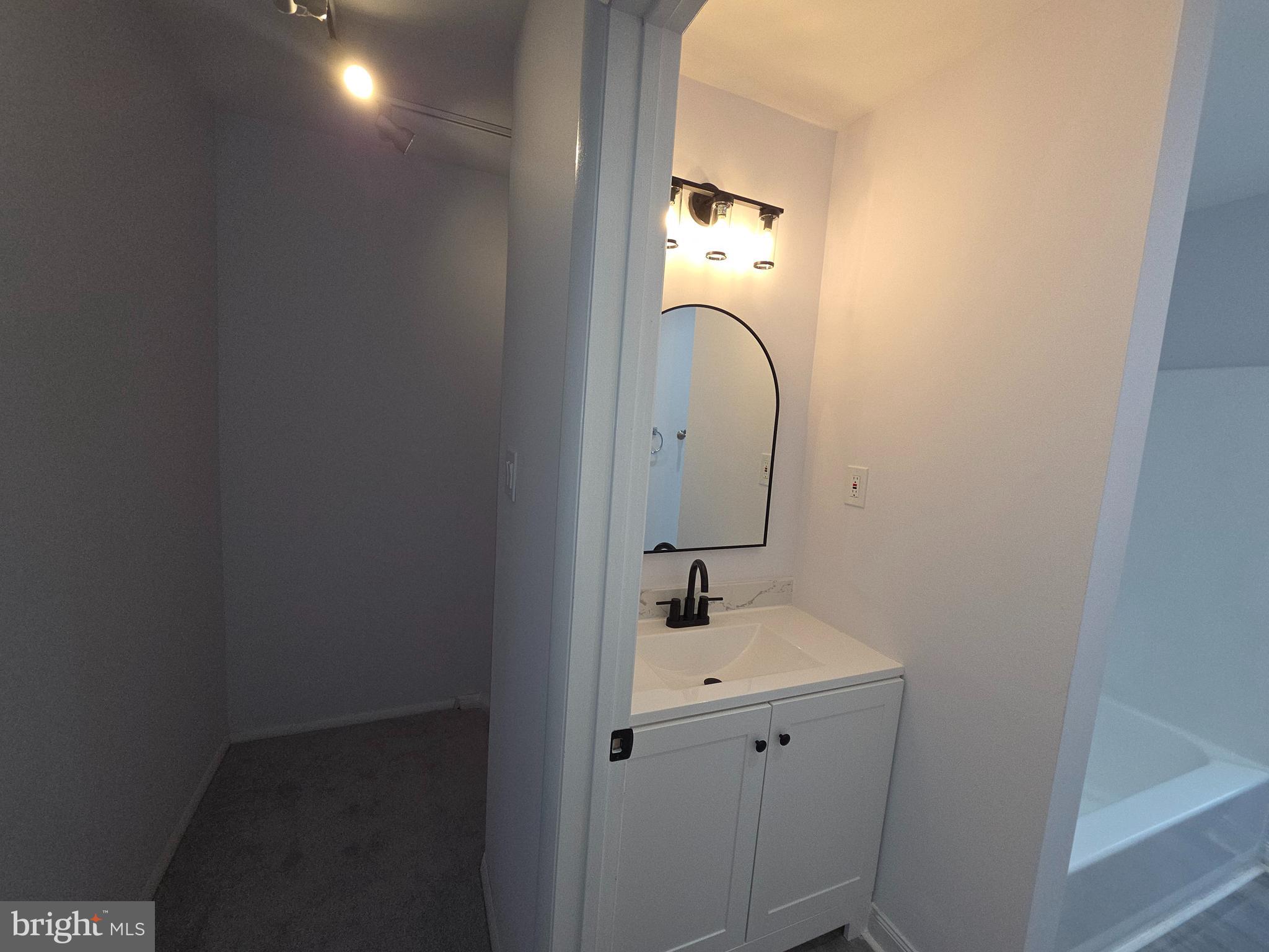 70 Suburban Boulevard Delran, NJ 08075 - Photo 26 of 40 a bathroom with a sink and mirror
