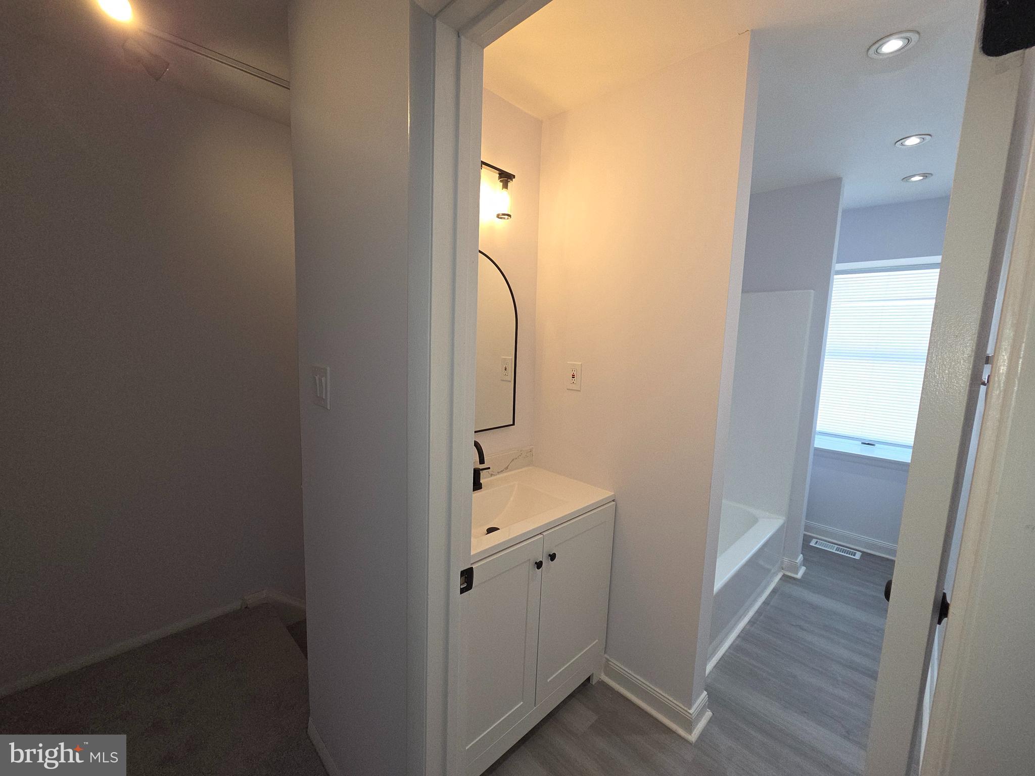 70 Suburban Boulevard Delran, NJ 08075 - Photo 27 of 40 a bathroom with a sink and mirror with toilet