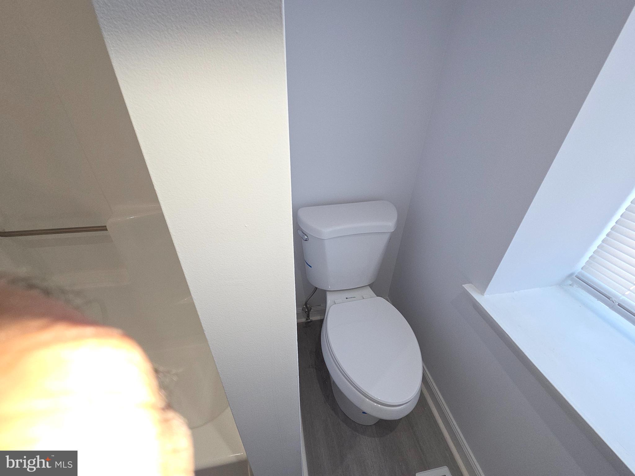 70 Suburban Boulevard Delran, NJ 08075 - Photo 28 of 40 a white toilet sitting next to a small window