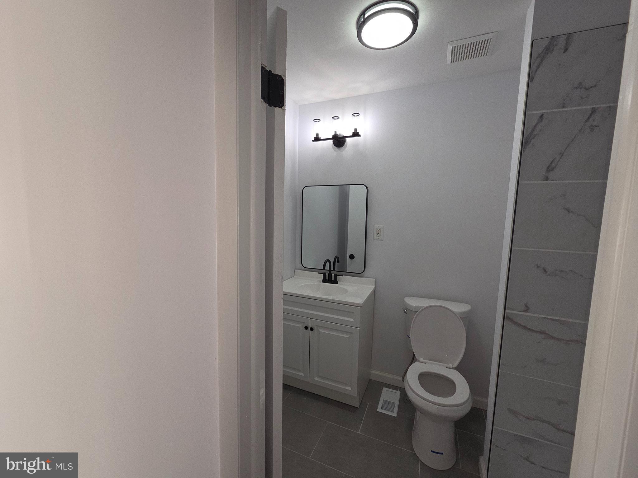 70 Suburban Boulevard Delran, NJ 08075 - Photo 36 of 40 a bathroom with a toilet and a sink