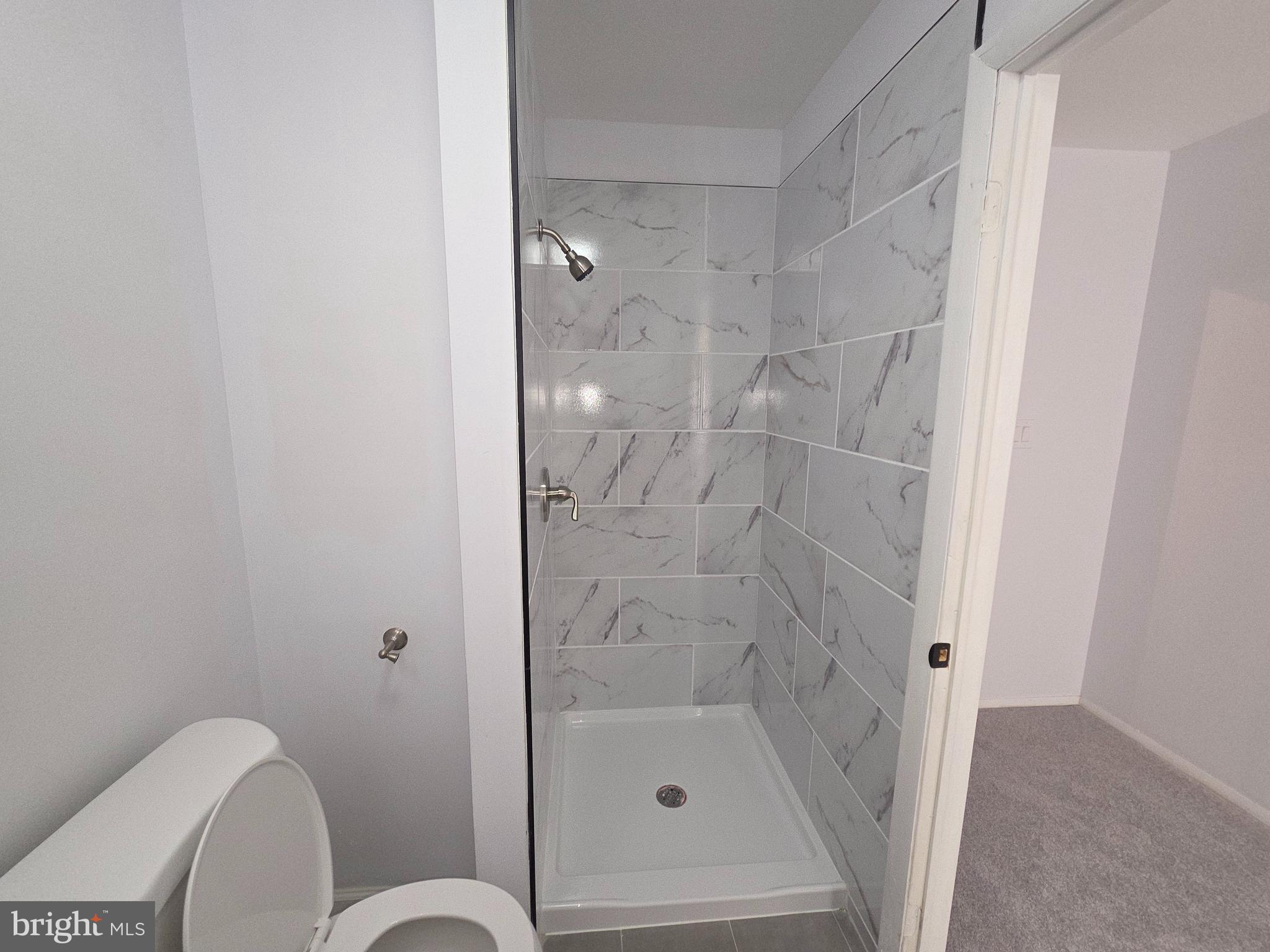 70 Suburban Boulevard Delran, NJ 08075 - Photo 37 of 40 a bathroom with a shower and toilet