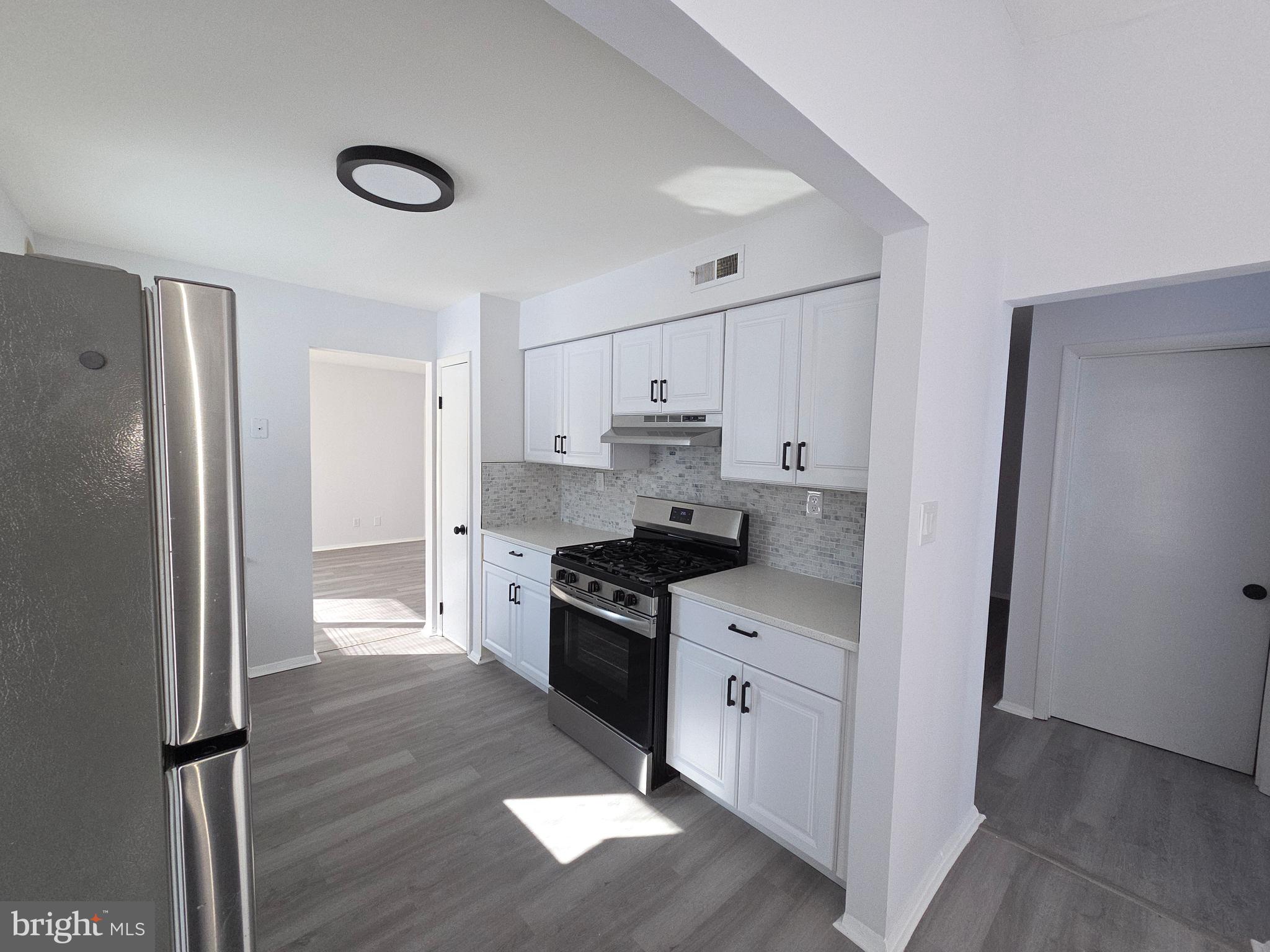 70 Suburban Boulevard Delran, NJ 08075 - Photo 5 of 40 a kitchen with stainless steel appliances granite countertop a refrigerator and a stove