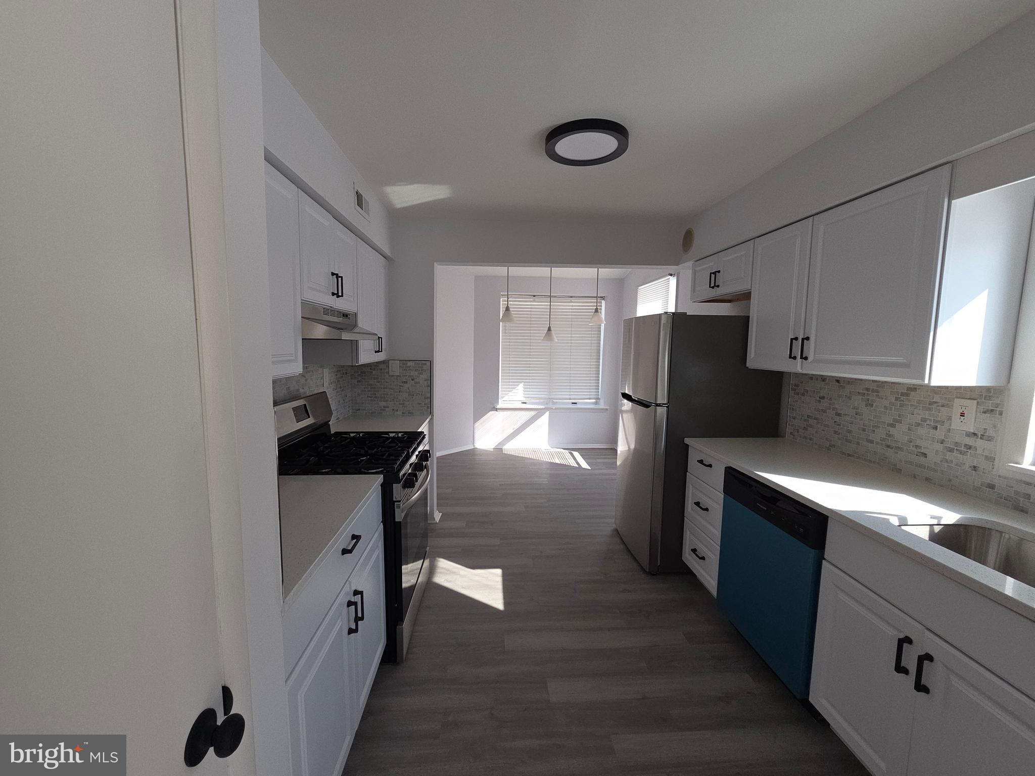 70 Suburban Boulevard Delran, NJ 08075 - Photo 7 of 40 a kitchen with stainless steel appliances granite countertop a refrigerator a stove and a sink