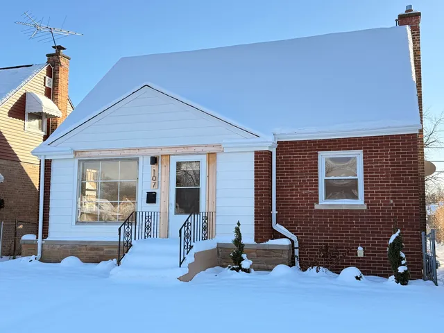 a front view of a house with a outdoor seating