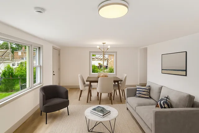 a view of a dining room with furniture window and outside view