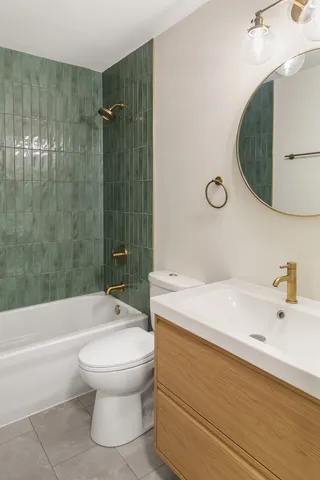 a bathroom with a sink a toilet and a bathtub