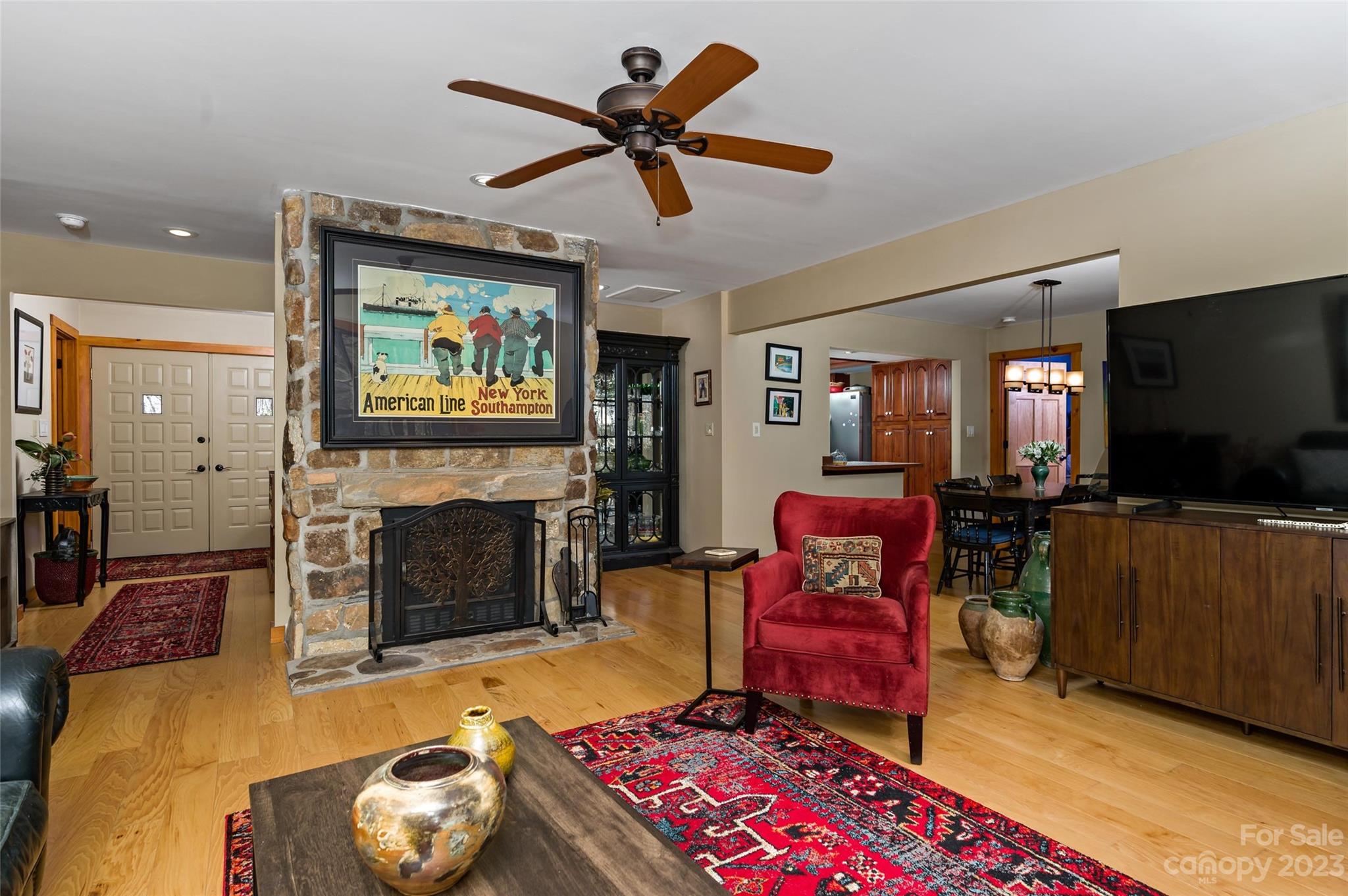 139 Panther Gap Road Brevard, NC 28712 - Photo 16 of 42 a living room with furniture and a flat screen tv