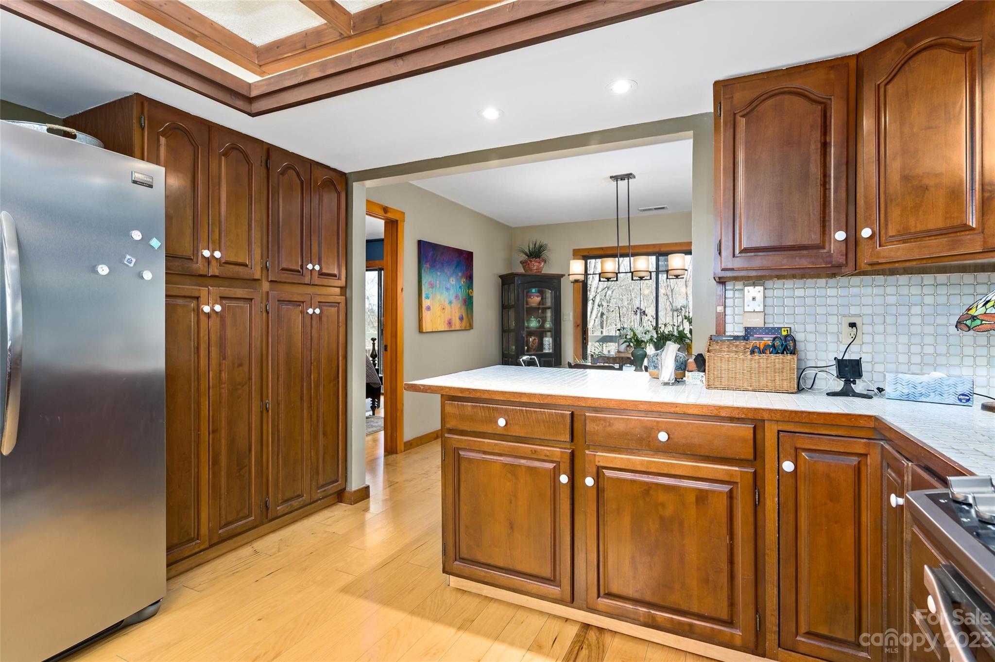 139 Panther Gap Road Brevard, NC 28712 - Photo 20 of 42 a kitchen with stainless steel appliances granite countertop a refrigerator and a sink