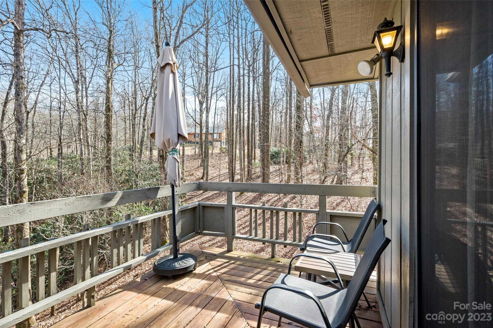 139 Panther Gap Road Brevard, NC 28712 - Photo 29 of 42 a view of a balcony with chairs