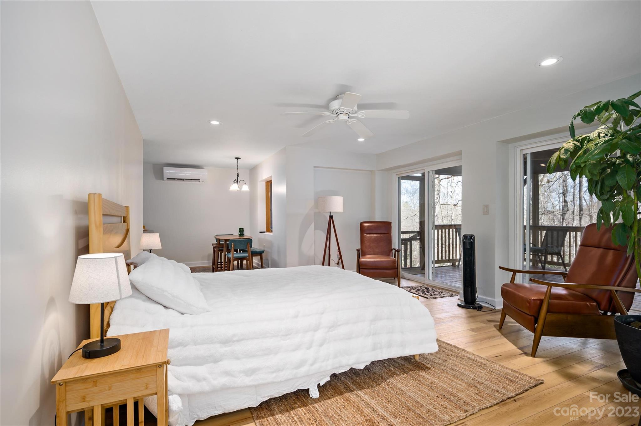 139 Panther Gap Road Brevard, NC 28712 - Photo 33 of 42 a bedroom with a bed a couch and dresser