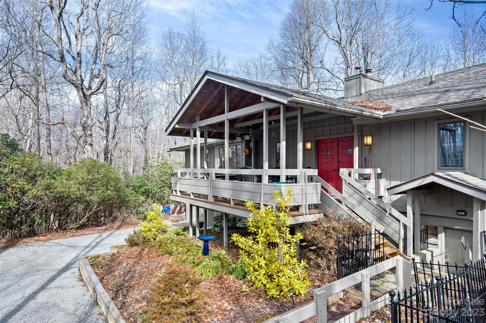 139 Panther Gap Road Brevard, NC 28712 - Photo 7 of 42 a front view of house with yard outdoor seating and barbeque oven