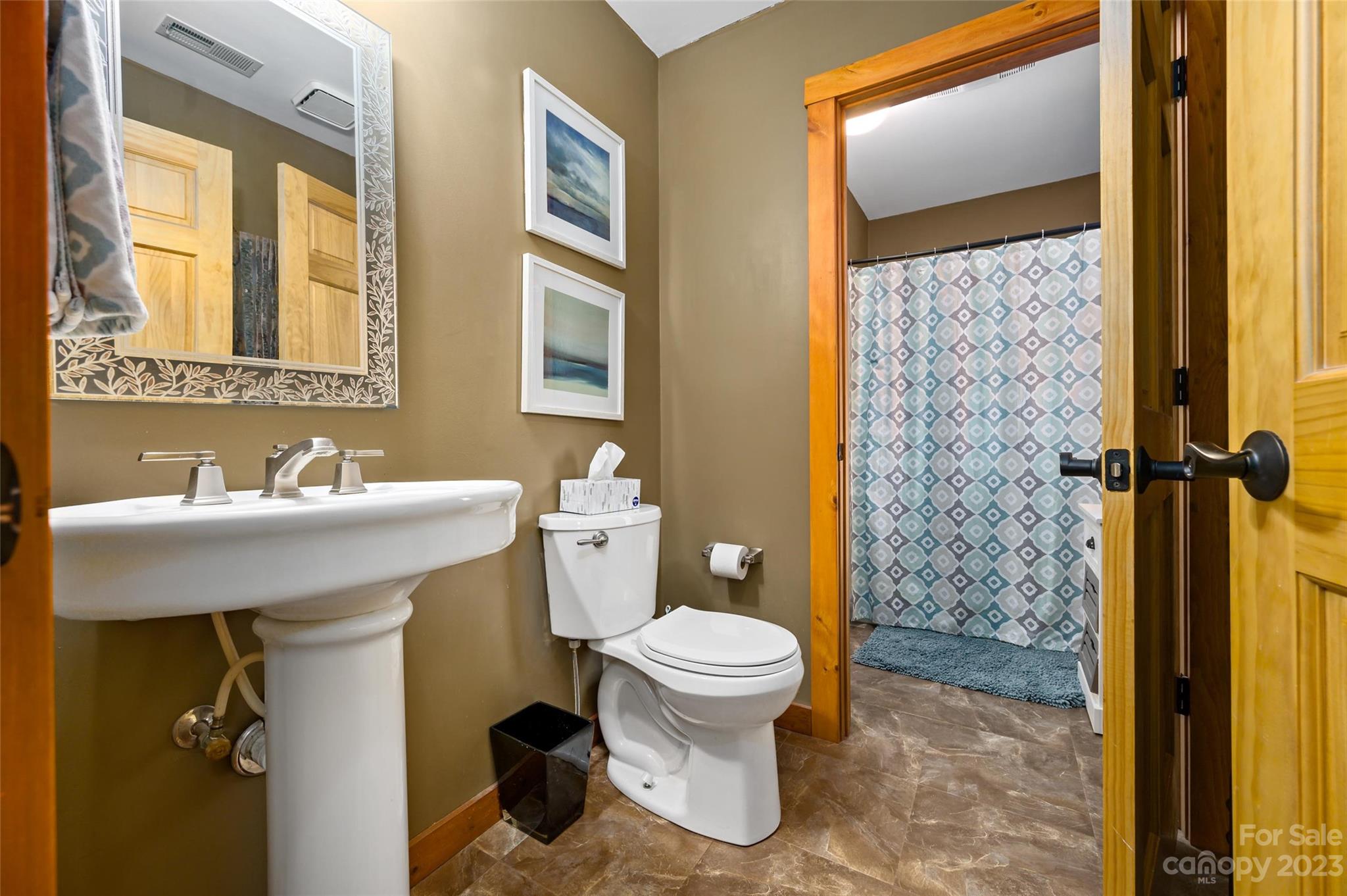 139 Panther Gap Road Brevard, NC 28712 - Photo 10 of 42 a bathroom with a sink toilet and shower