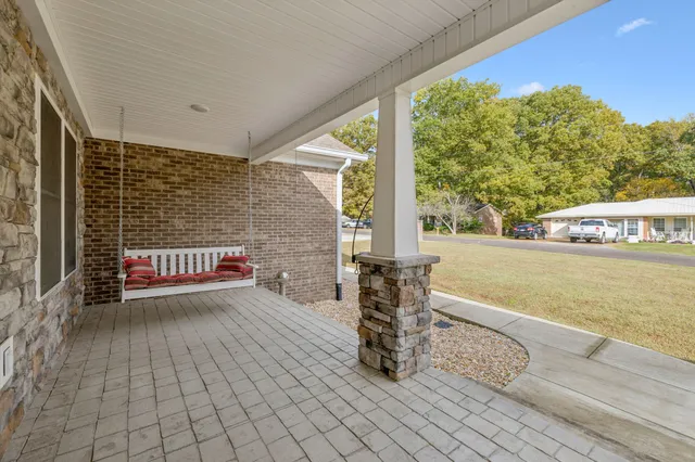 a living room with fireplace furniture and a flat screen tv