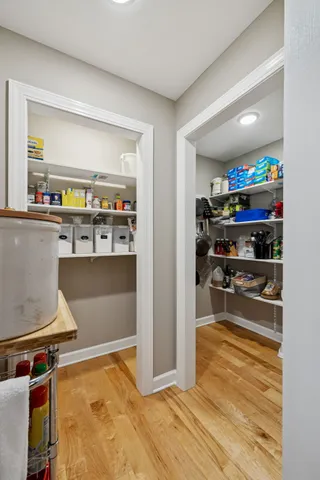 a workspace with wooden floor and a ceiling fan