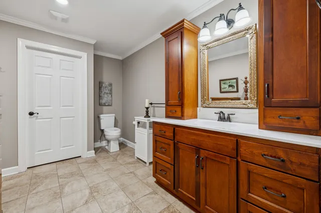 a living room with lots of furniture and a chandelier