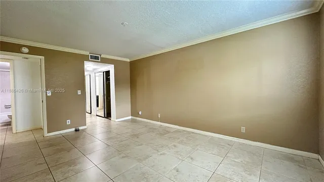 an empty room with a bathroom