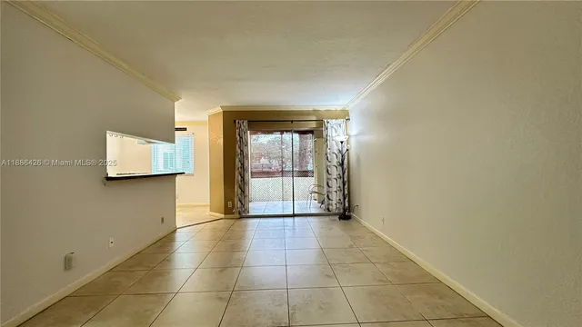 a view of an empty room and window