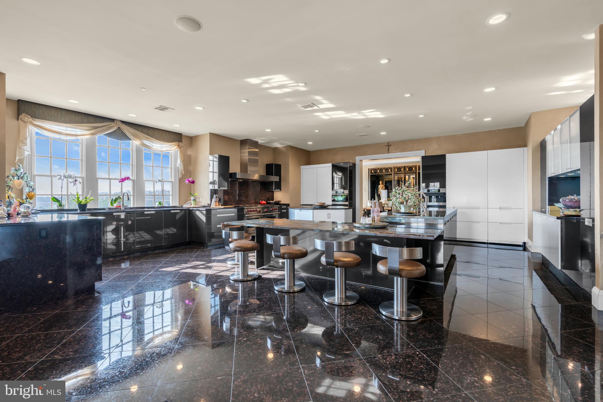 1041 Oval Road Manasquan, NJ 08736 - Photo 12 of 30 a kitchen with lots of counter top space a sink appliances and cabinets
