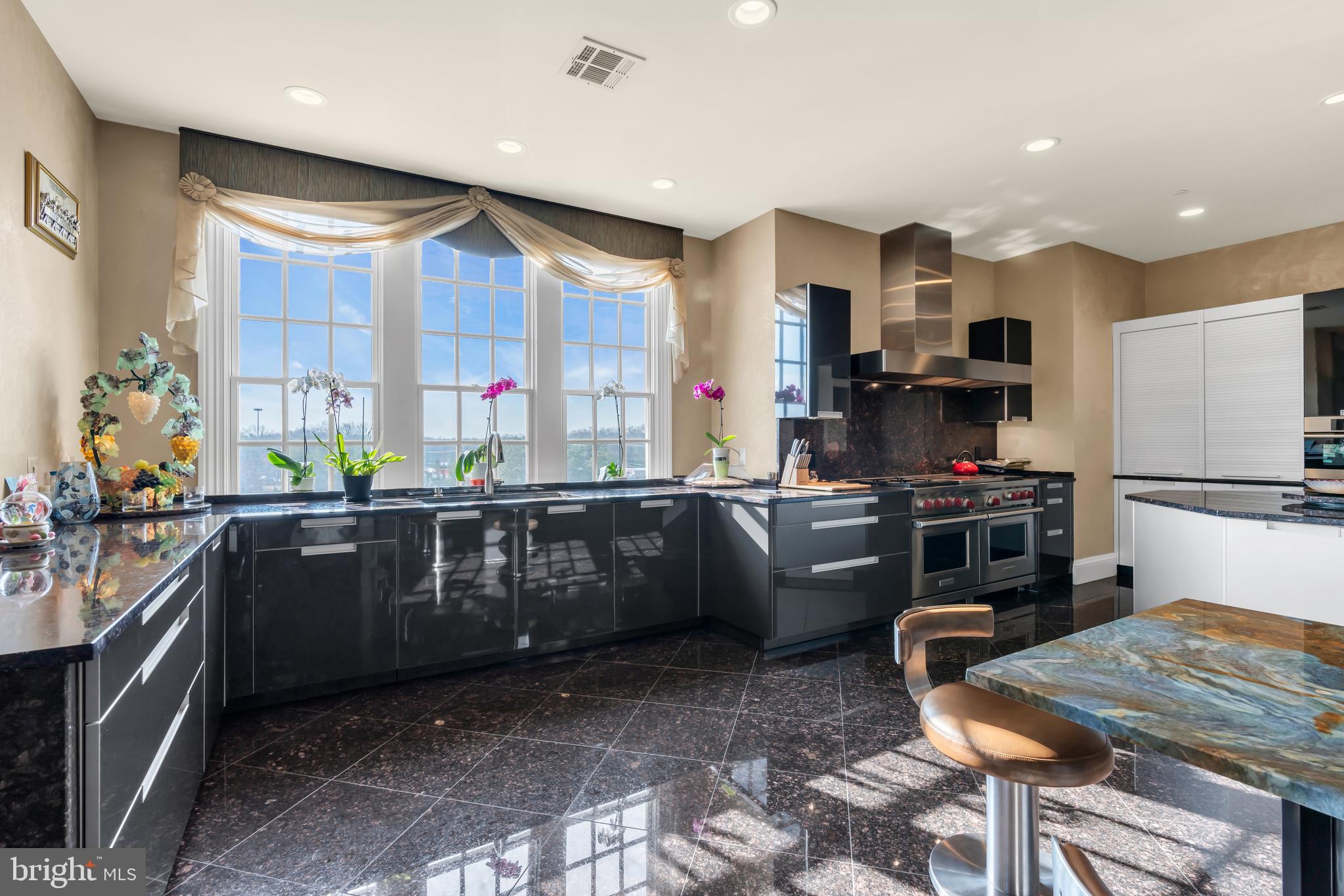 1041 Oval Road Manasquan, NJ 08736 - Photo 14 of 30 a kitchen with lots of counter top space and appliances