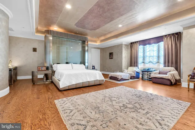 a spacious bathroom with a double vanity sink and a mirror