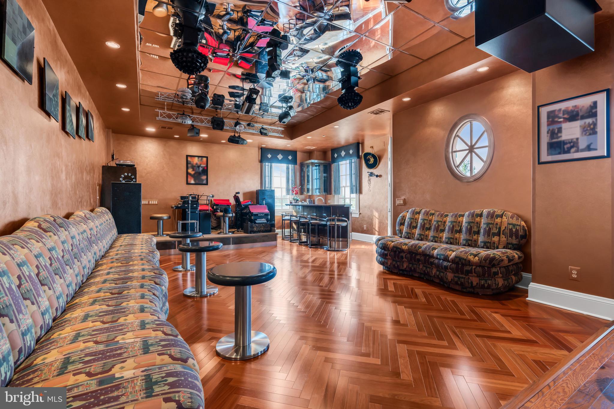 1041 Oval Road Manasquan, NJ 08736 - Photo 26 of 30 a living room with furniture and a chandelier