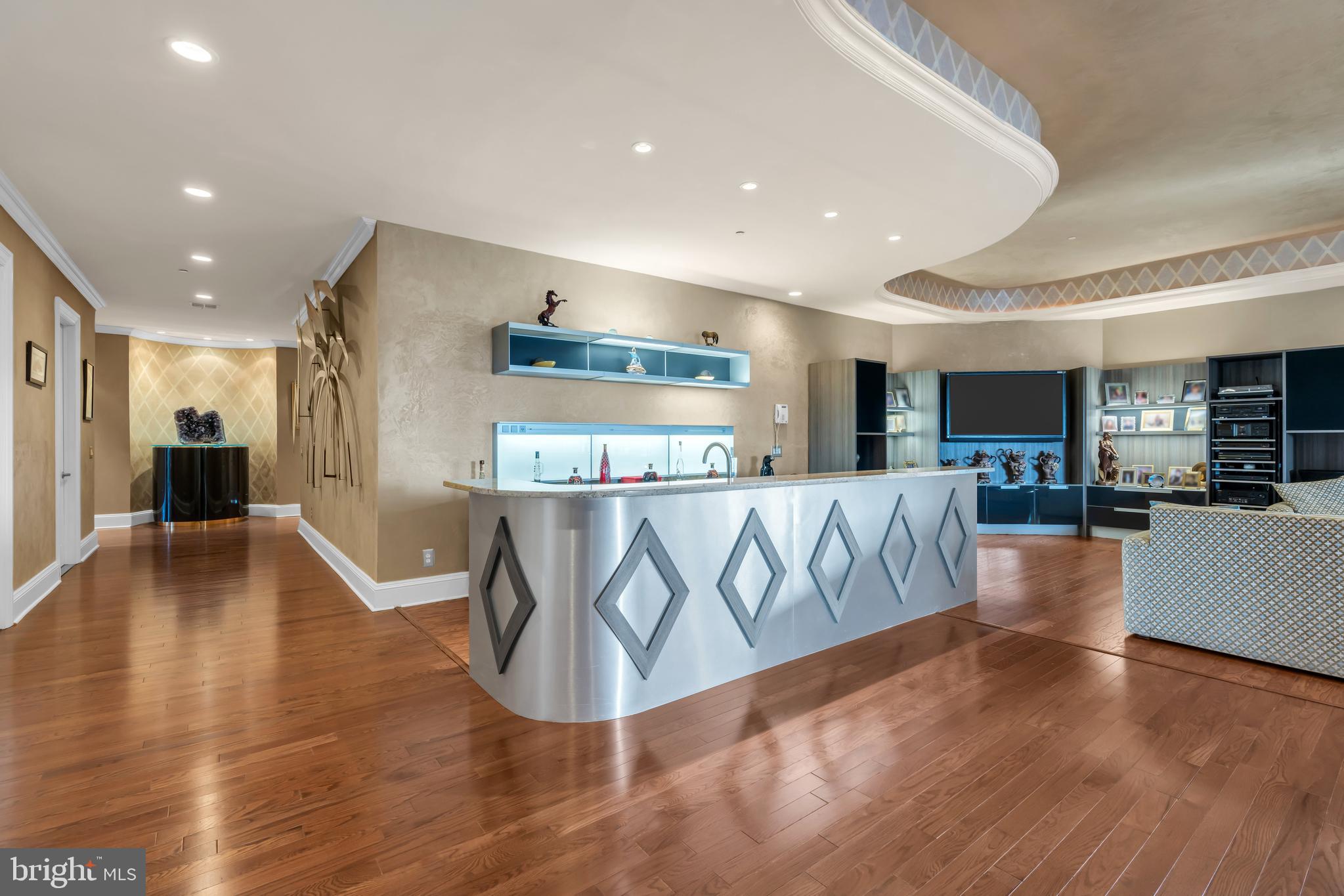 1041 Oval Road Manasquan, NJ 08736 - Photo 5 of 30 a view of a living room and kitchen with furniture
