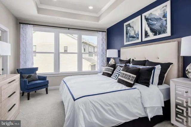 a bedroom with a bed and a couch