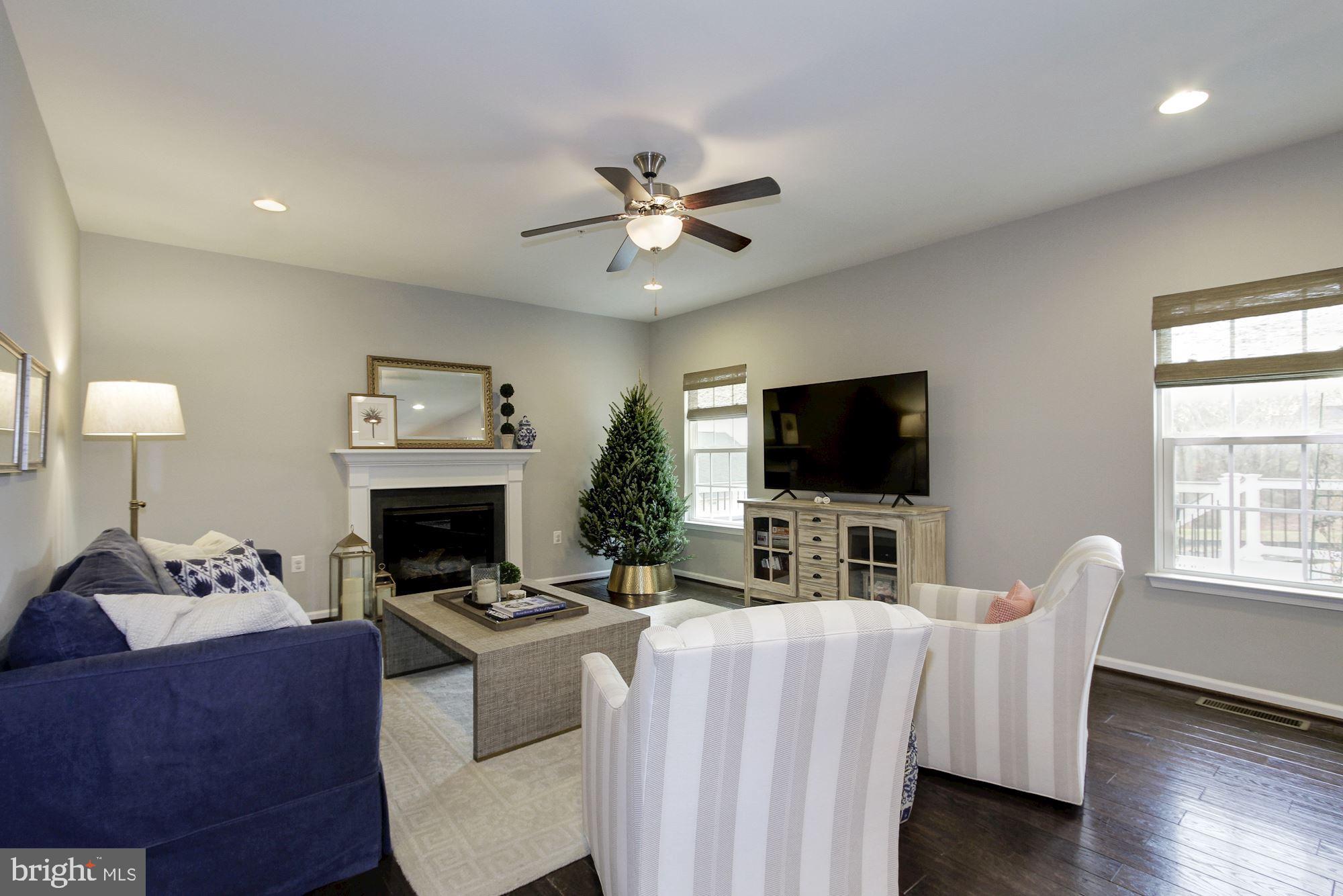 13747 Soaring Wing Lane Silver Spring, MD 20906 - Photo 10 of 27 Family Room with fireplace adjacent to Kitchen
