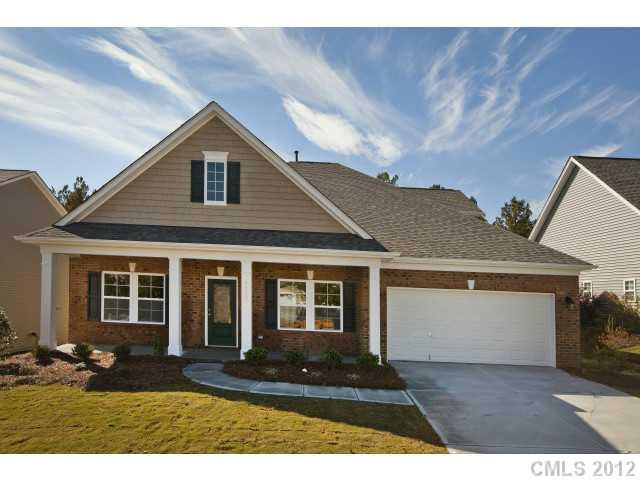 86593 Arrington Road, Unit 102 Lancaster, SC 29720 - Photo 1 of 15 a front view of a house with a yard