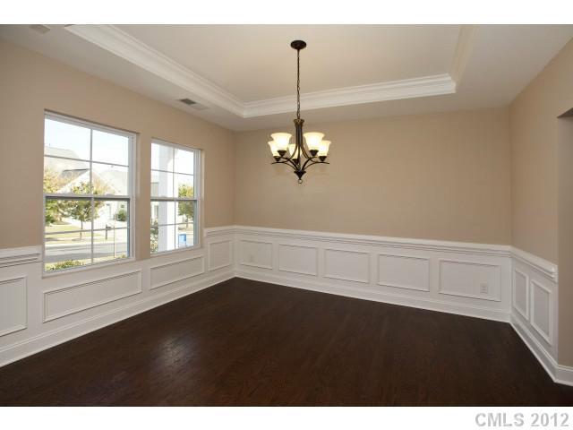 86593 Arrington Road, Unit 102 Lancaster, SC 29720 - Photo 3 of 15 a view of an empty room with wooden floor and a window