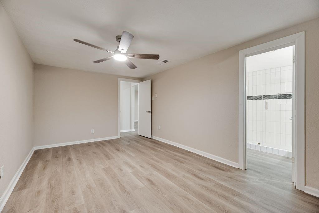 5706 Rocky Ridge Road Dallas, TX 75241 - Photo 19 of 31 a view of empty room with wooden floor