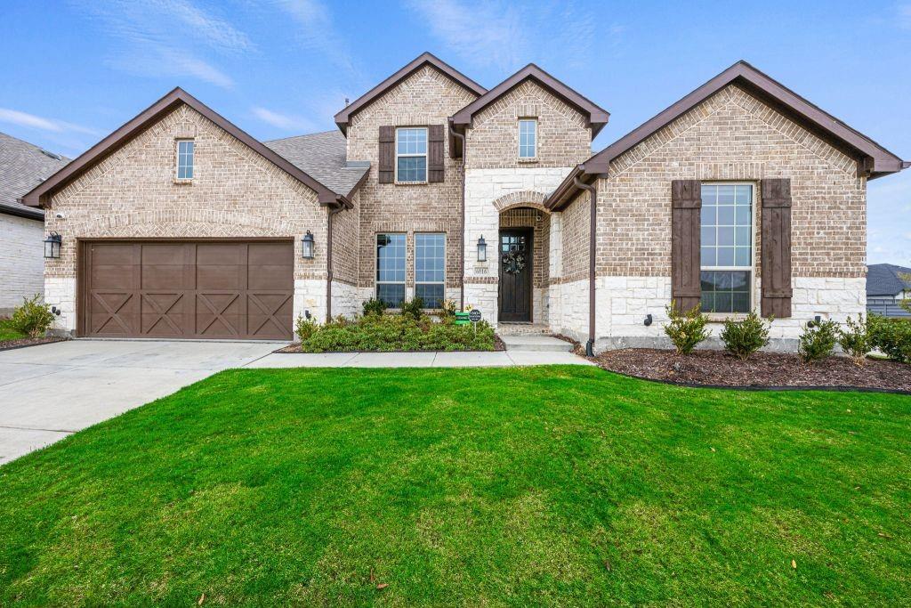 6016 Lowbranch Trail Little Elm, TX 76227 - Photo 1 of 1 a view of a house with a yard and pathway