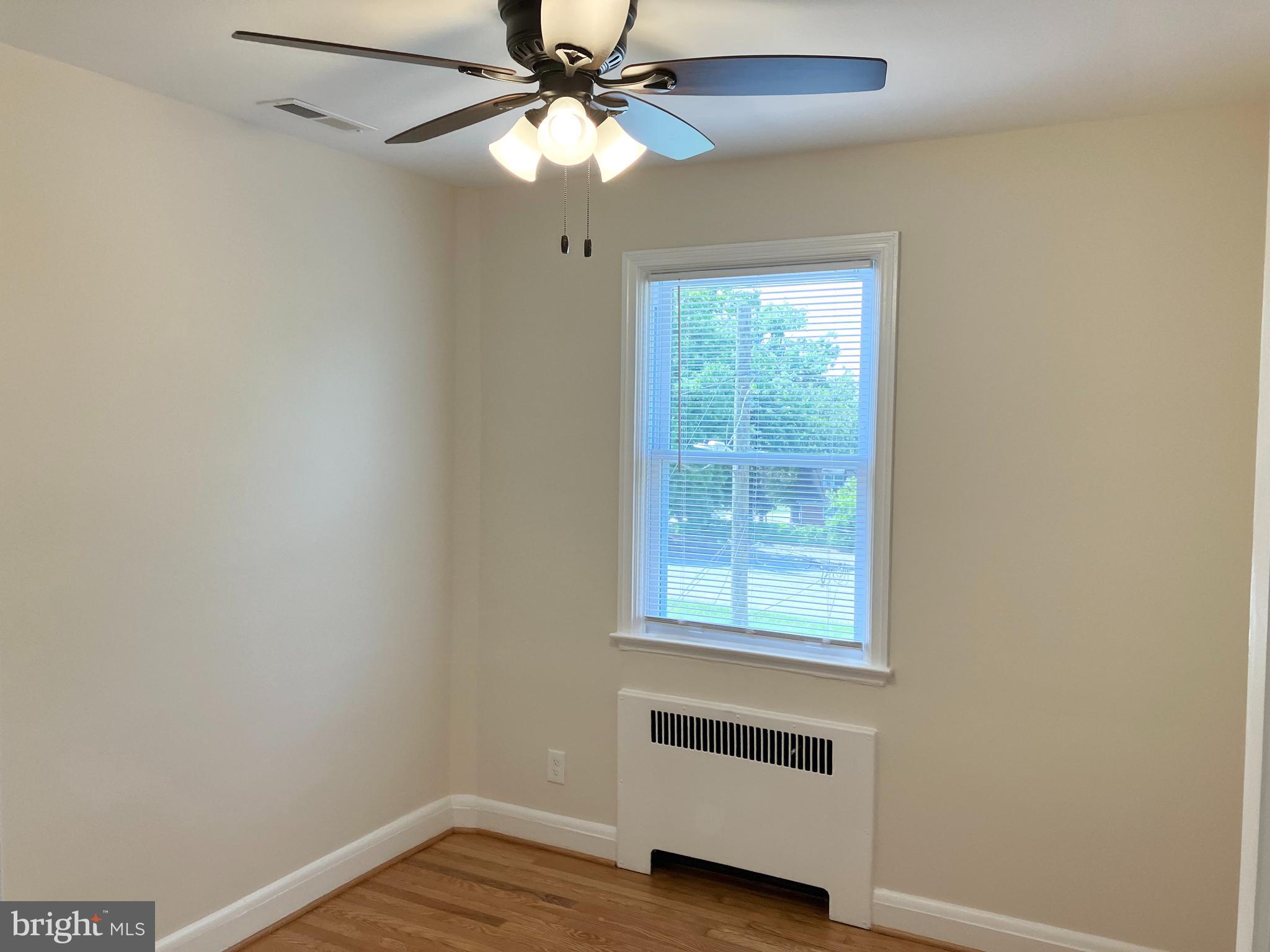4818 Coleherne Road Baltimore, MD 21229 - Photo 17 of 20 Third bedroom with hardwood and a ceiling fan.