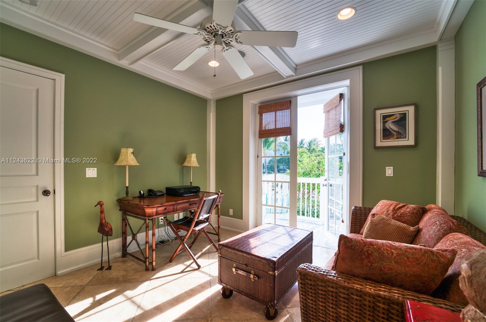 32 Sunset Key Drive Key West, FL 33040 - Photo 11 of 49 a workspace with furniture and a chandelier