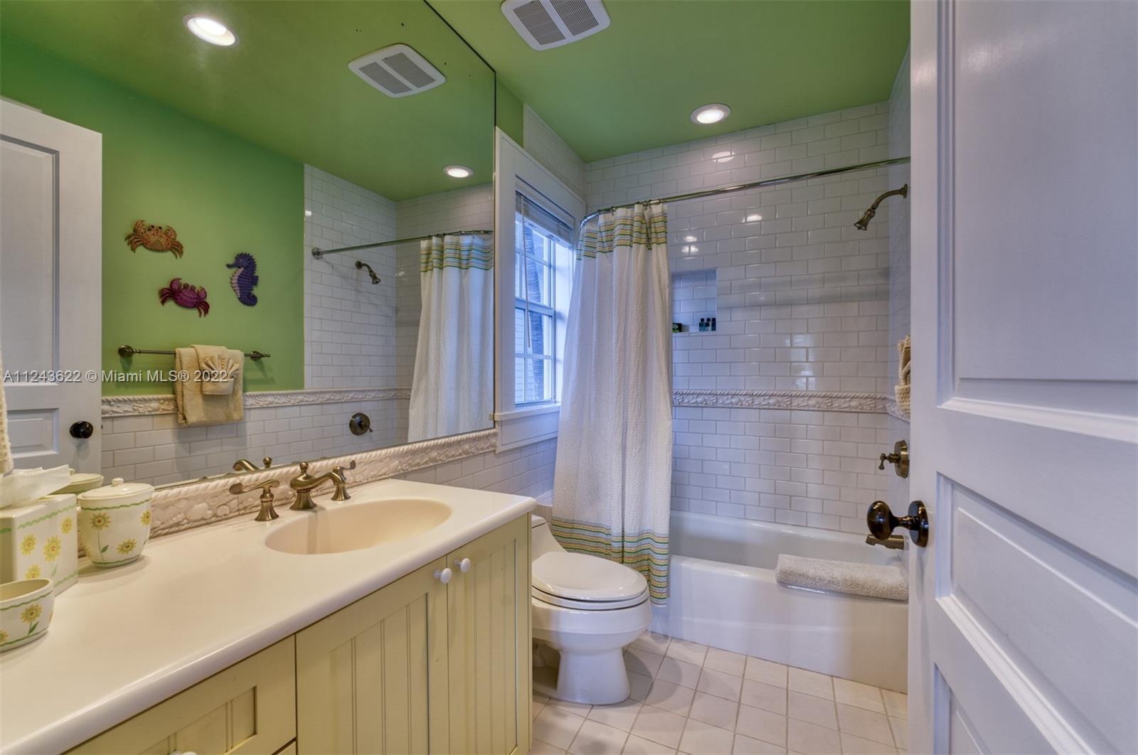 32 Sunset Key Drive Key West, FL 33040 - Photo 15 of 49 a bathroom with a granite countertop sink toilet and shower