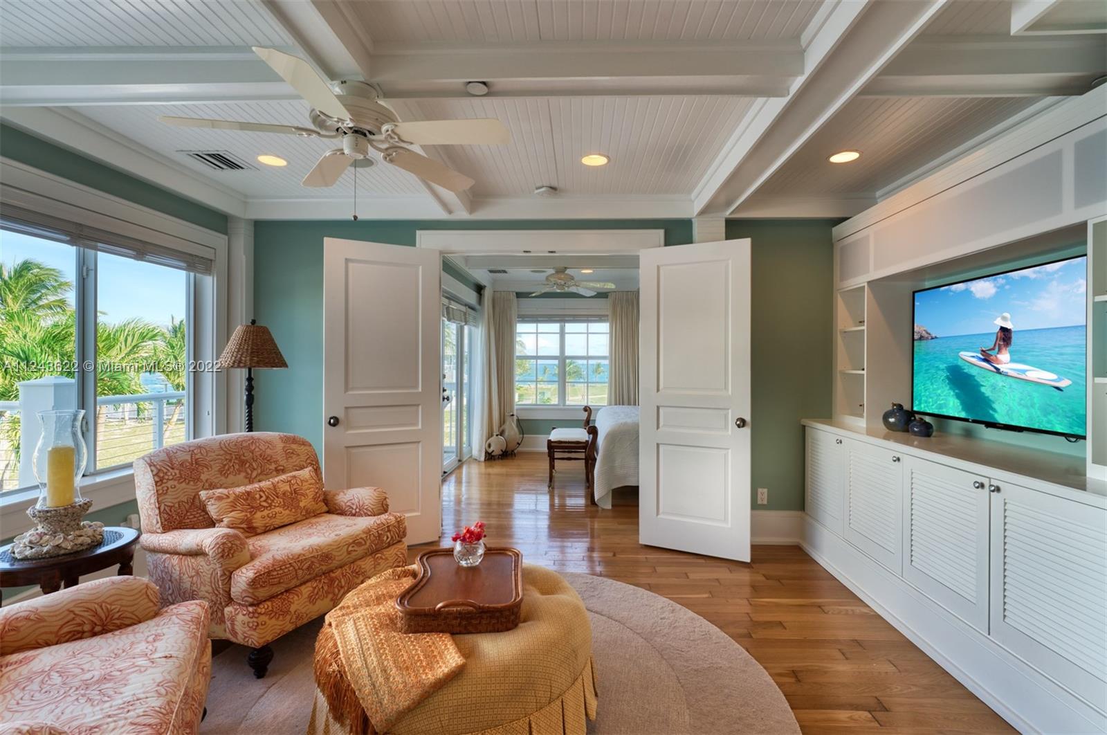 32 Sunset Key Drive Key West, FL 33040 - Photo 19 of 49 a living room with furniture and a flat screen tv
