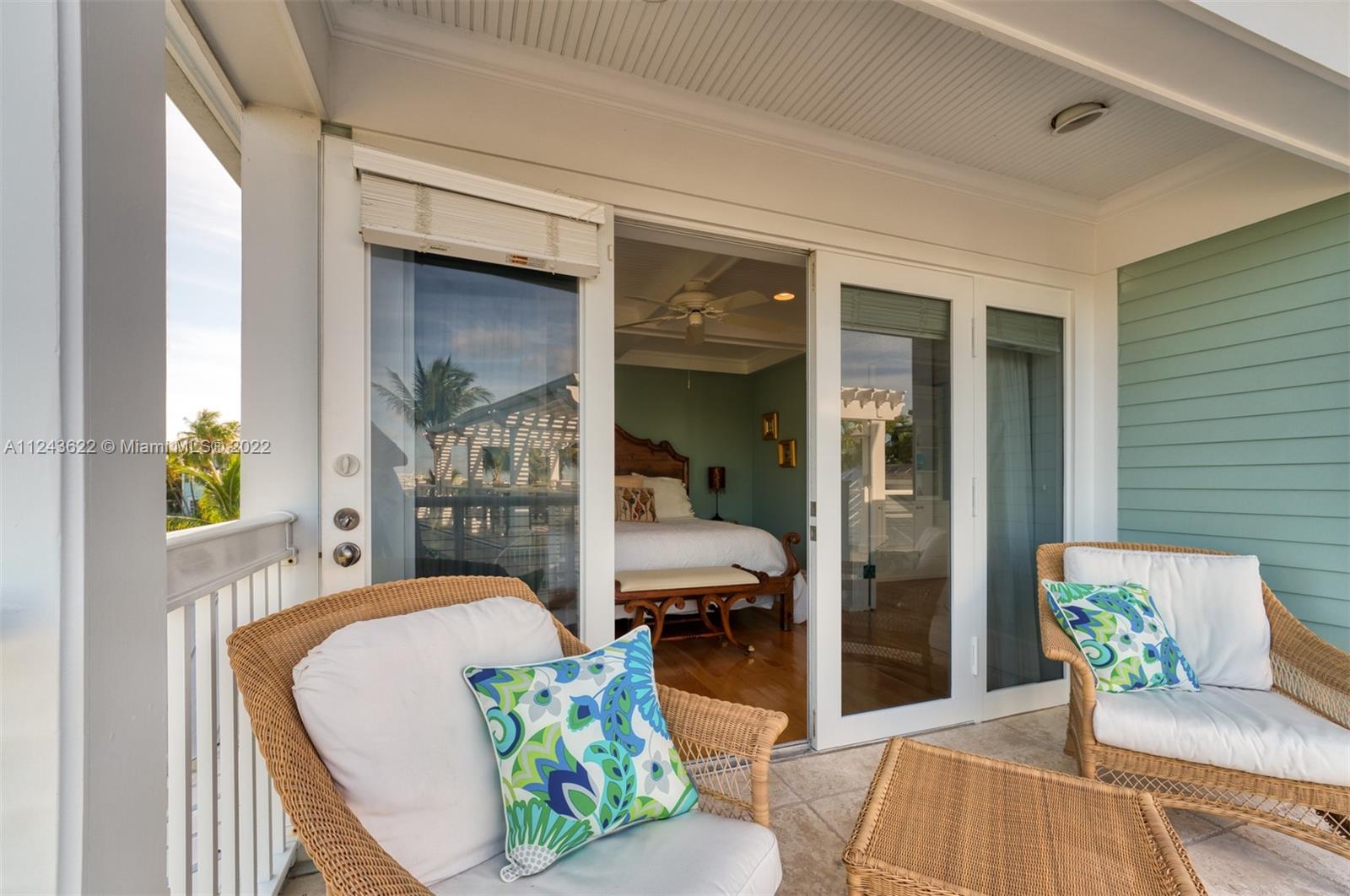 32 Sunset Key Drive Key West, FL 33040 - Photo 24 of 49 a living room with furniture and a potted plant