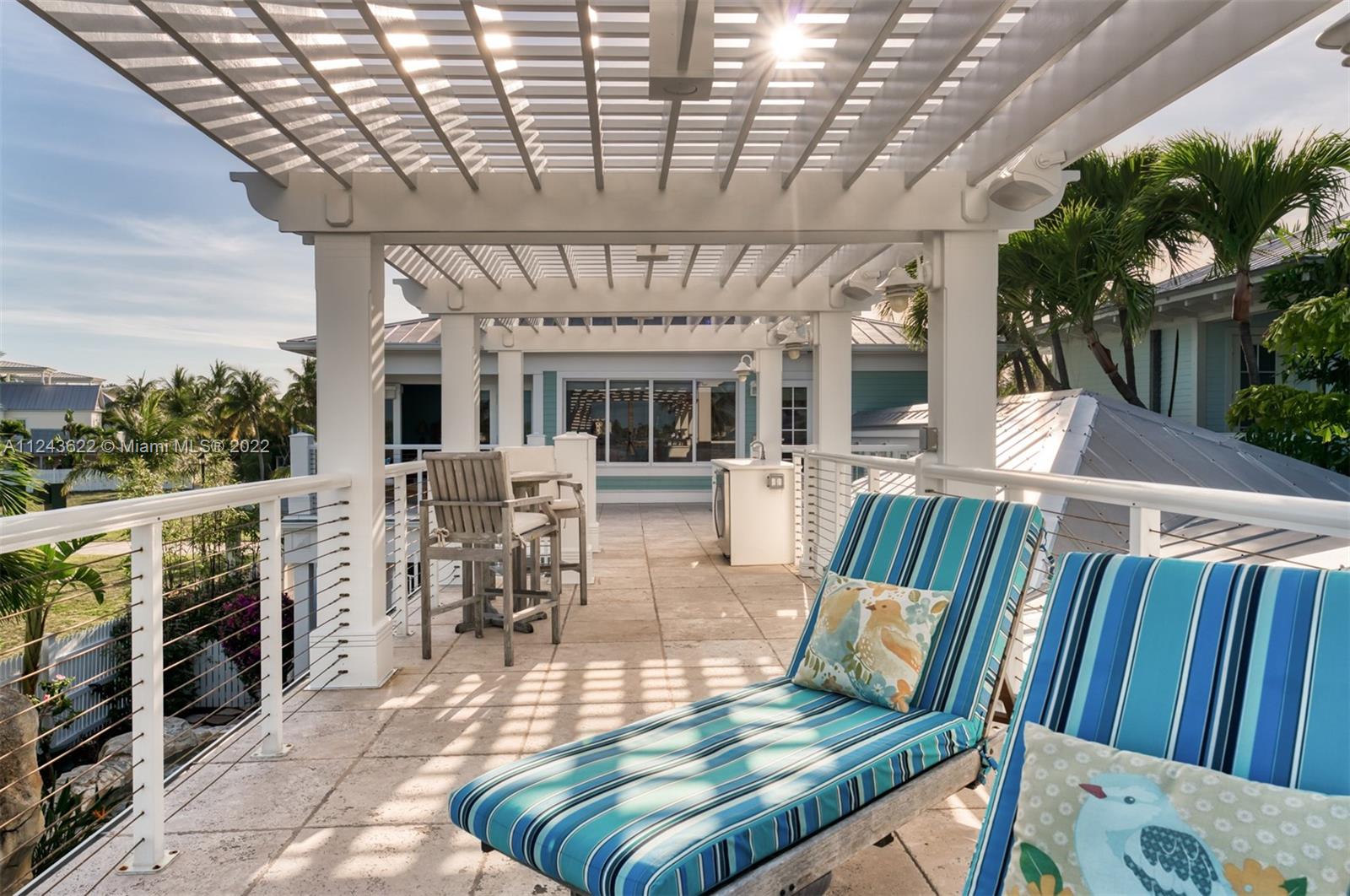 32 Sunset Key Drive Key West, FL 33040 - Photo 25 of 49 a view of a patio with furniture