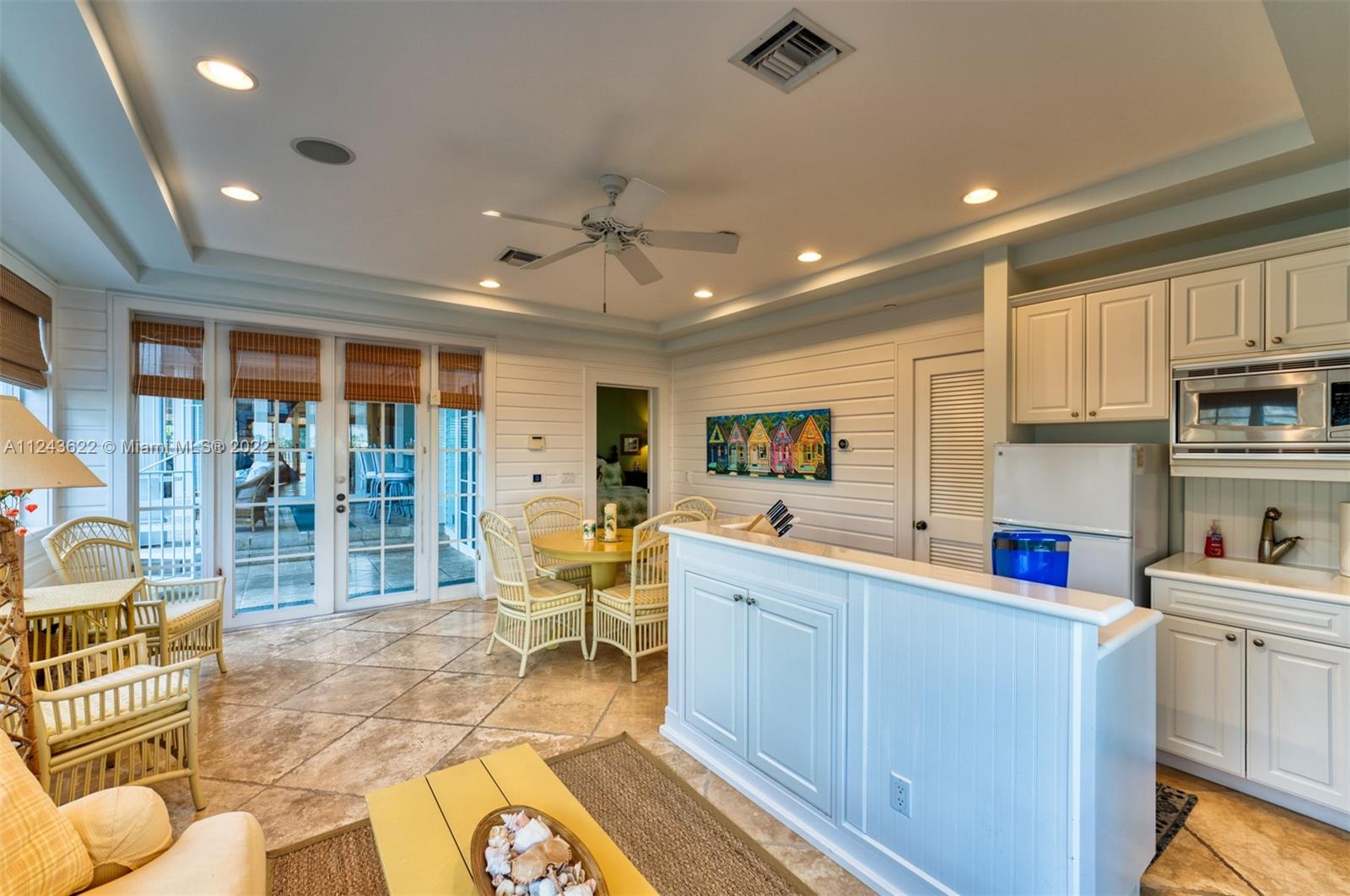 32 Sunset Key Drive Key West, FL 33040 - Photo 35 of 49 a kitchen with stainless steel appliances kitchen island granite countertop a sink and cabinets