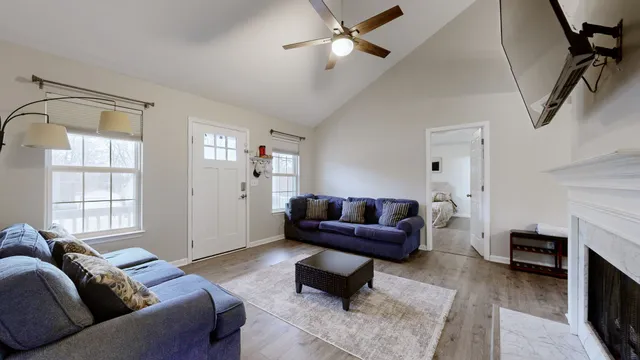 a living room with furniture and a fireplace