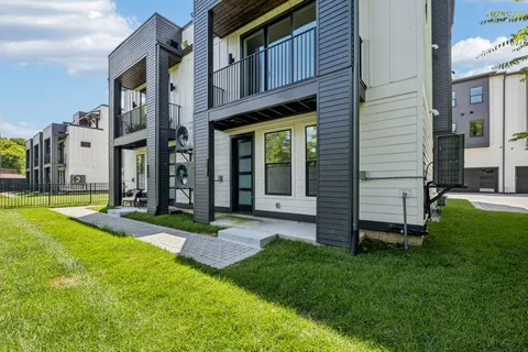 a view of a house with a yard porch and sitting area