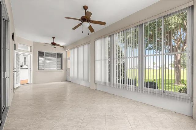 a view of a livingroom with a furniture and a ceiling fan