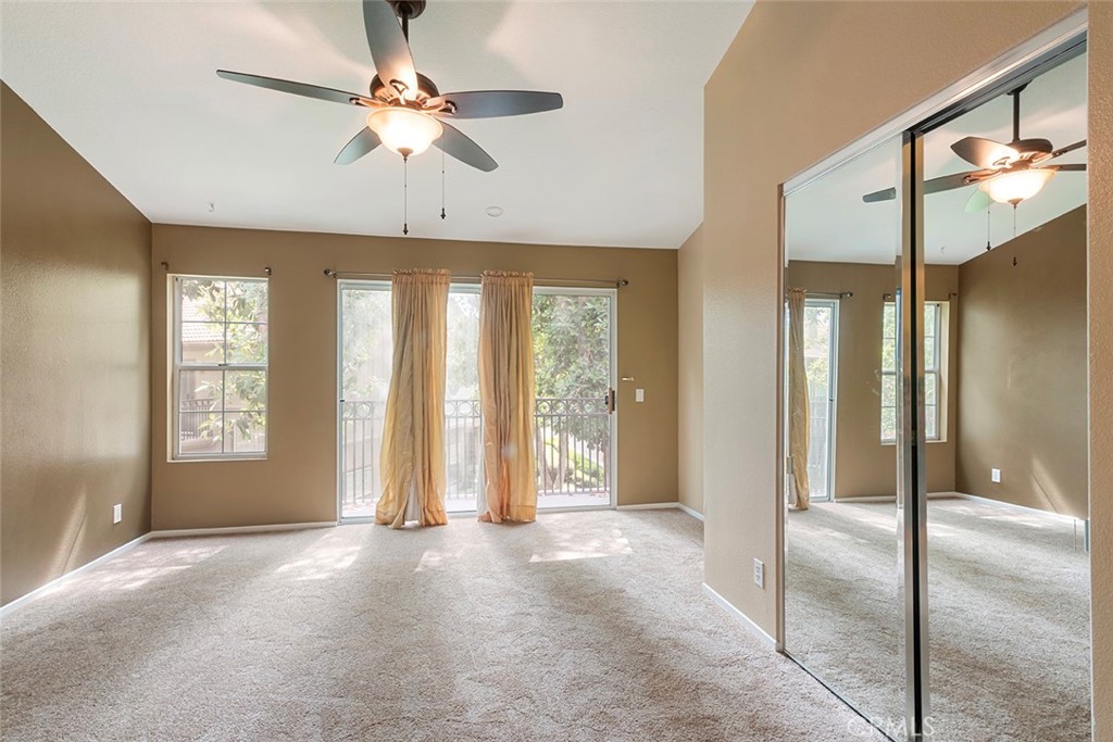27726 Rubidoux Mission Viejo, CA 92692 - Photo 27 of 31 a view of an empty room with a fireplace and a chandelier