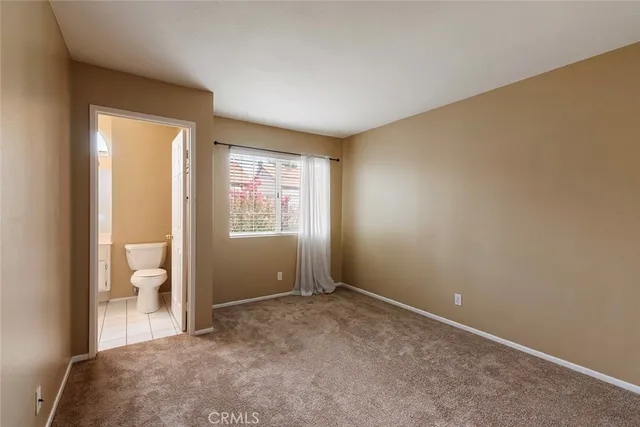 a view of room with window and hallway