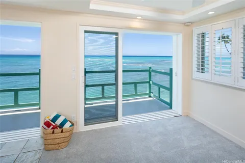 a large room with a large window and furniture